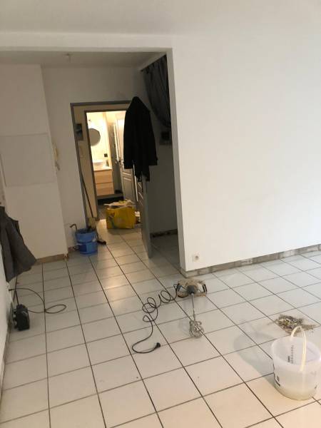 Pose de sol PVC à Blanquefort - La rénovation de votre salon salle à manger par Globale Rénovation Bruges